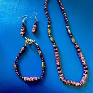 Purple stone set in silver with crystals